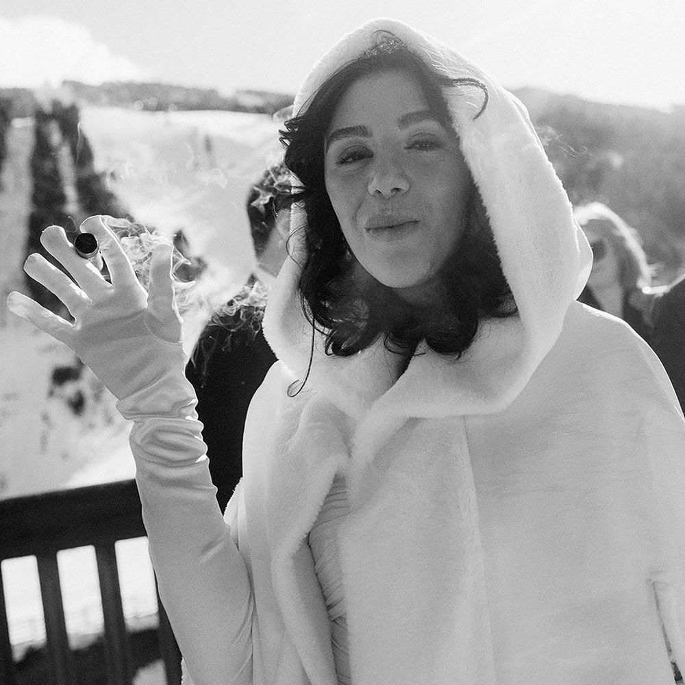 Bride in fur hooded coat for winter wedding