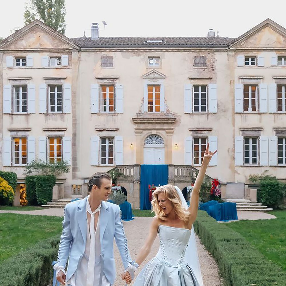 Light blue bride and groom wedding outfits