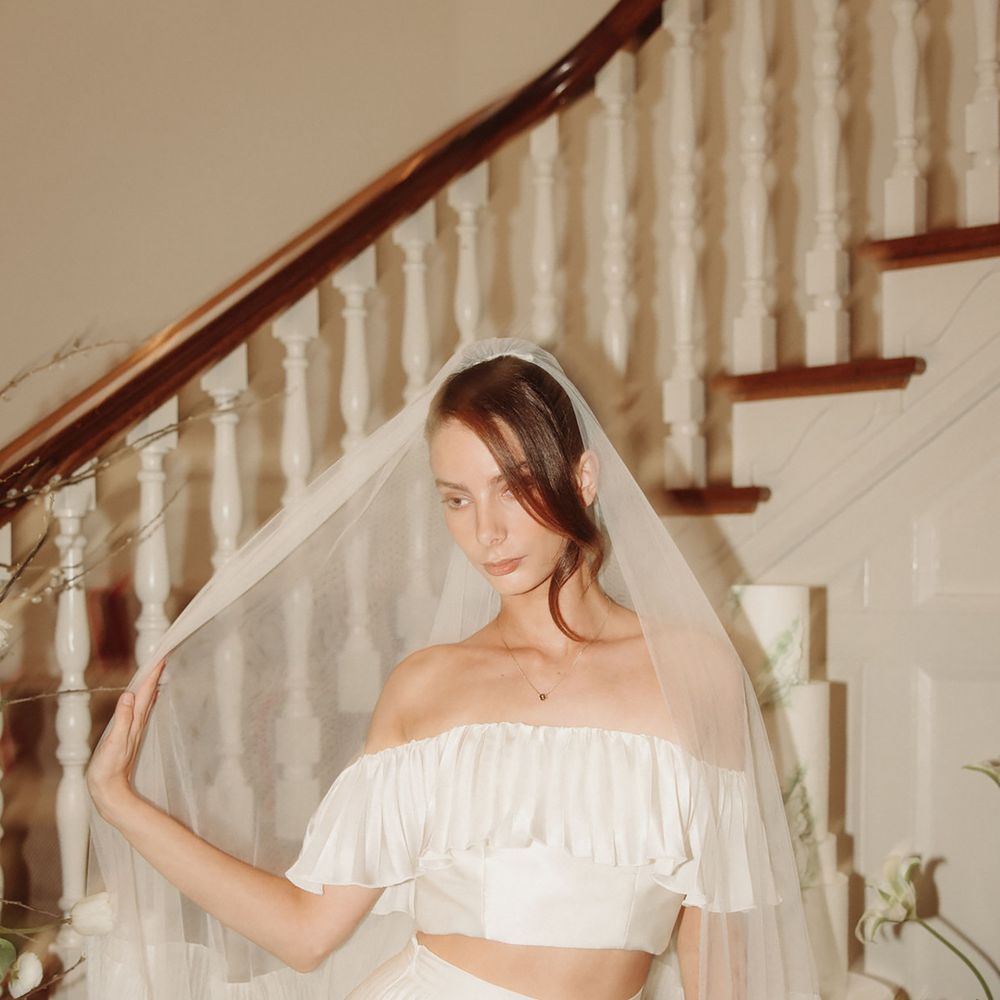 Two piece wedding dress with bardot crop top and pleated maxi skirt