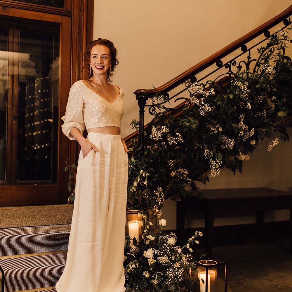 Two piece wedding dress with sparkly cropped v neck top and flowy maxi skirt 