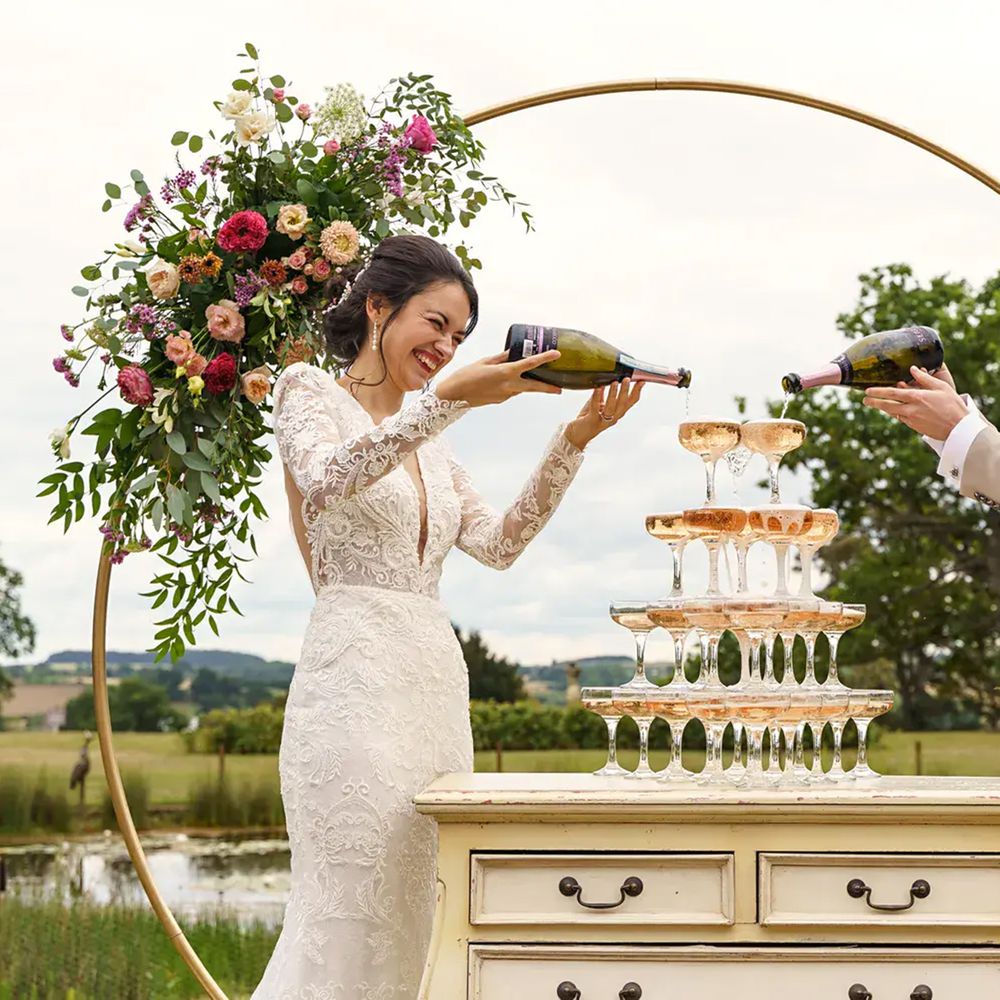 Davenport House circle floral wedding arch champagne tower