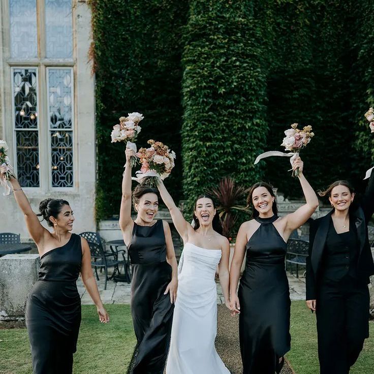 Bridal Party Wearing Black Satin Bridesmaid Dresses With Different Necklines