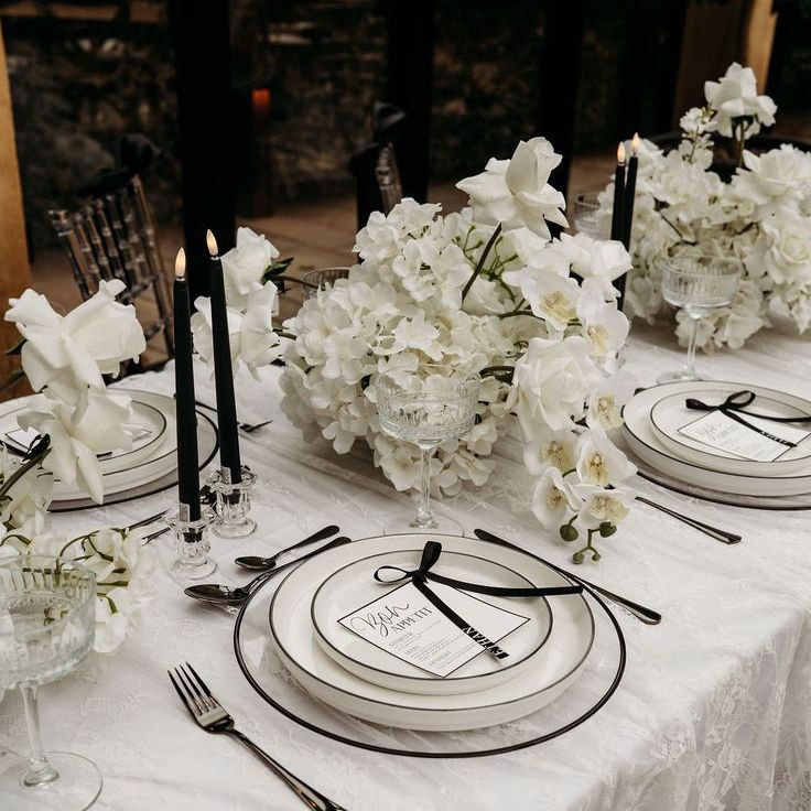 Monochrome Wedding Tablescape with Black Bows, Candles & White Floral Arrangements