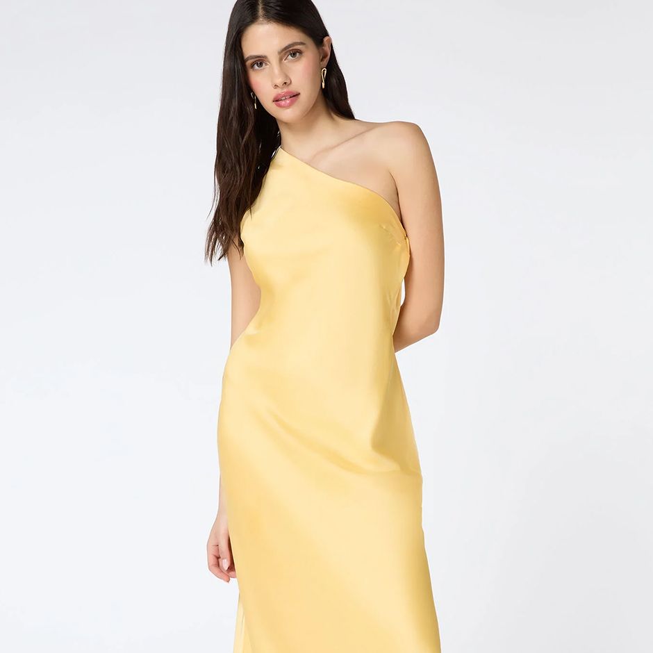 butter yellow cocktail wedding guest dress with asymmetric shoulder and maxi length 