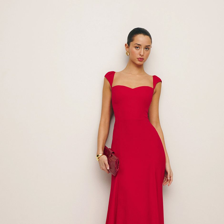 red cocktail wedding guest dress from reformation with fitted bodice and A-line skirt.