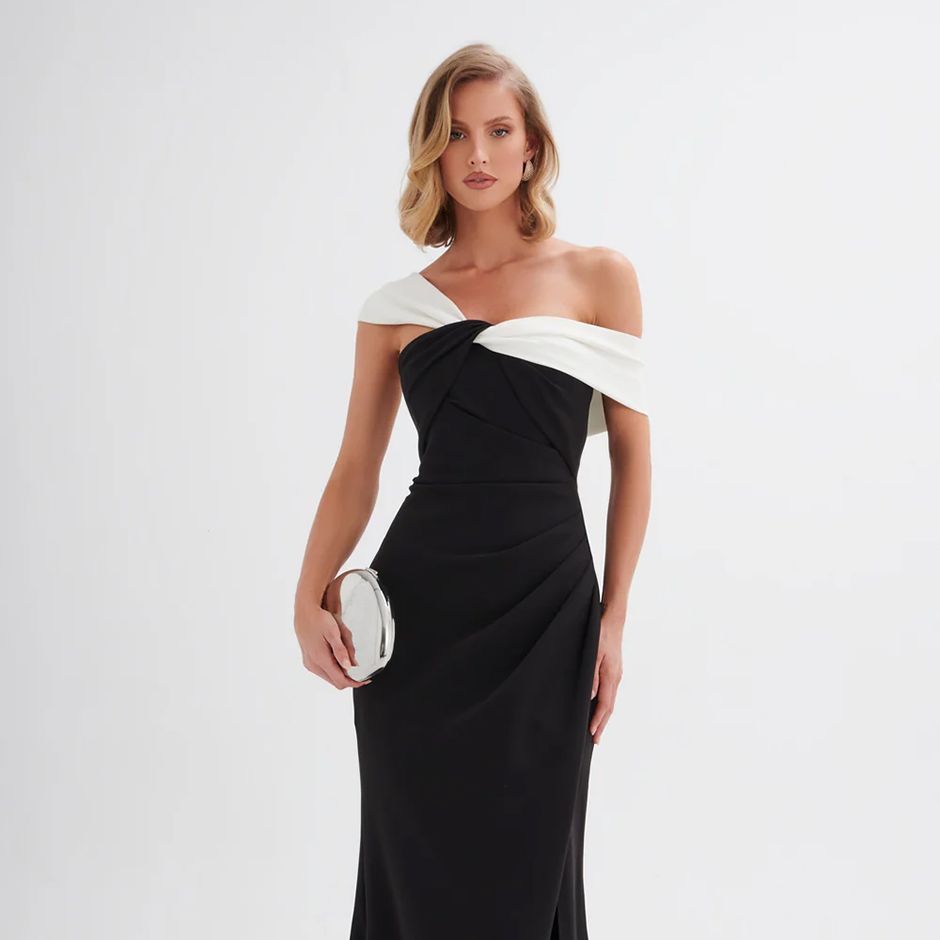 classic black and white maxi black tie wedding guest dress, featuring twisted one-shoulder design