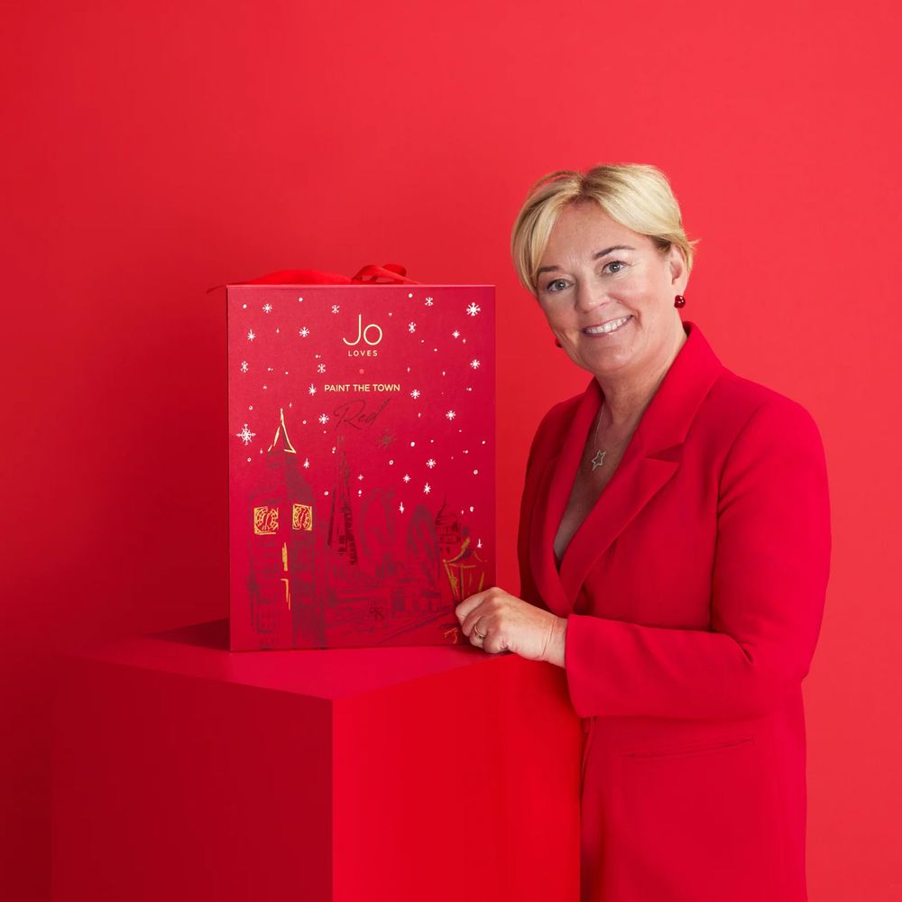 Jo Loves Advent Calendar 2025, lifestyle image founder, Jo Malone with the calendar