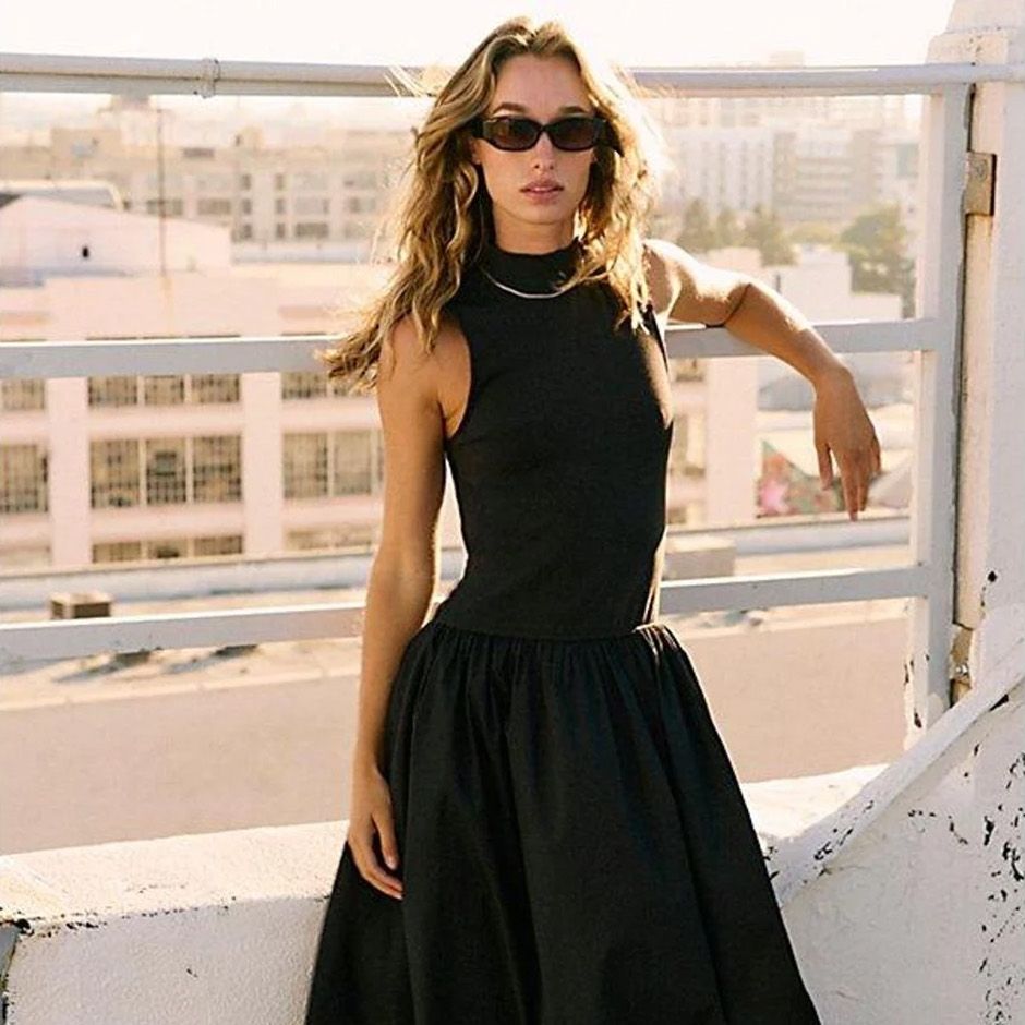 casual wedding guest dress in black with dropped A-line midi skirt