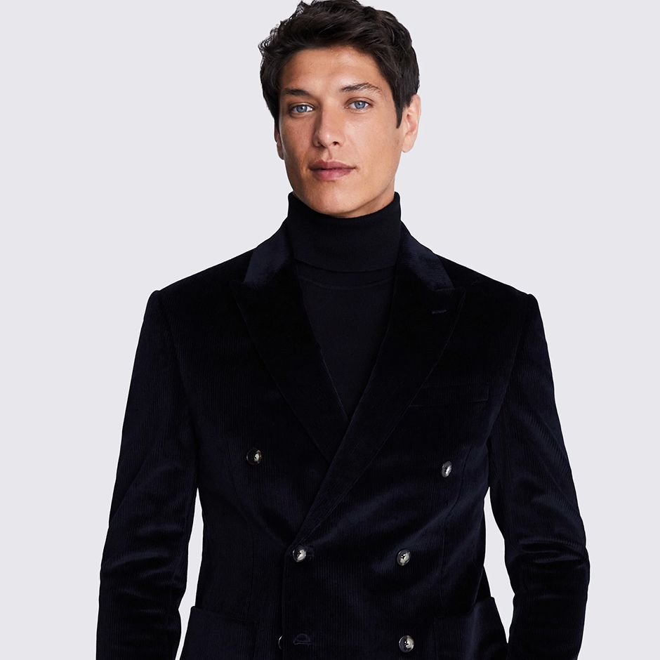 corduroy suit in dark ink-coloured blue/black tone as casual wedding attire idea for men