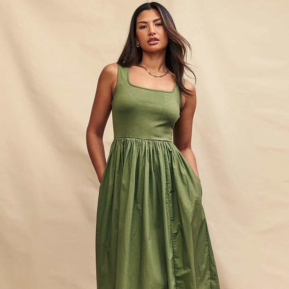 casual wedding guest dress in olive green with skater midi design