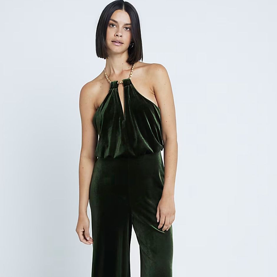 green velvet halter neck jumpsuit for casual wedding attire idea