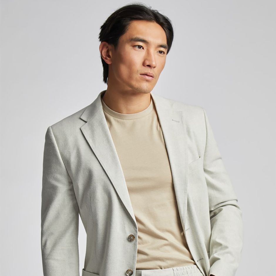 tailored fit blazer in stone colour as casual wedding attire idea for men