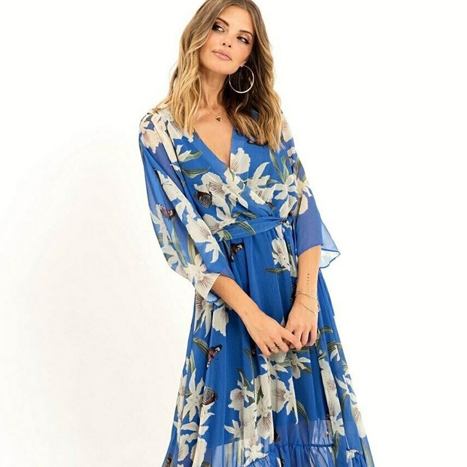 casual wedding guest dress in blue floral print, featuring kimono sleeves, wrap design and midi length