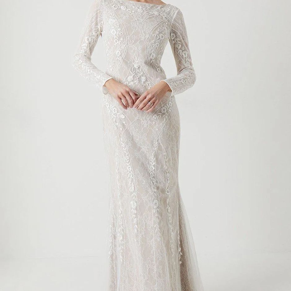 vintage style wedding dress with lace overlay and long sleeves