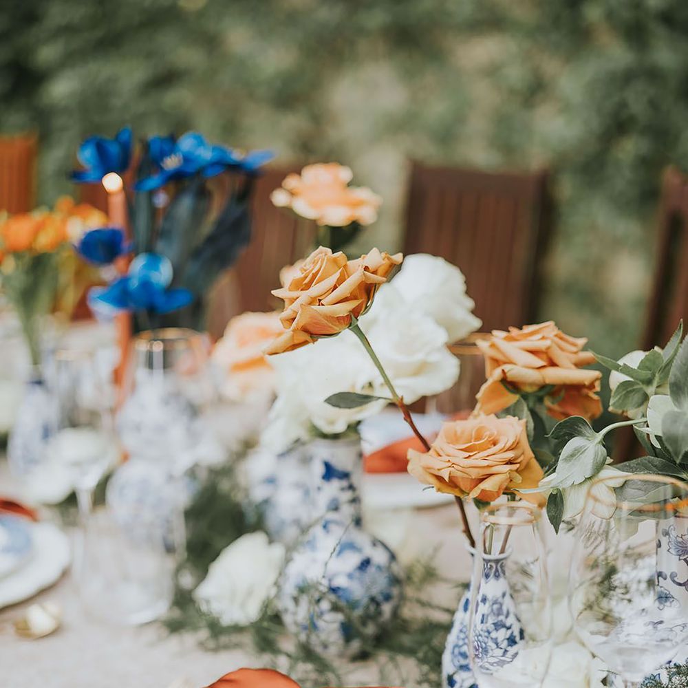 Blue and orange wedding colour scheme table decor