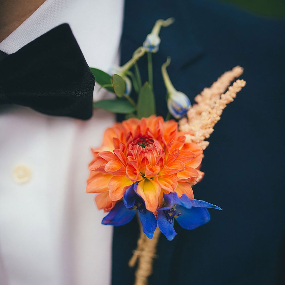 Blue and orange groom buttonhole