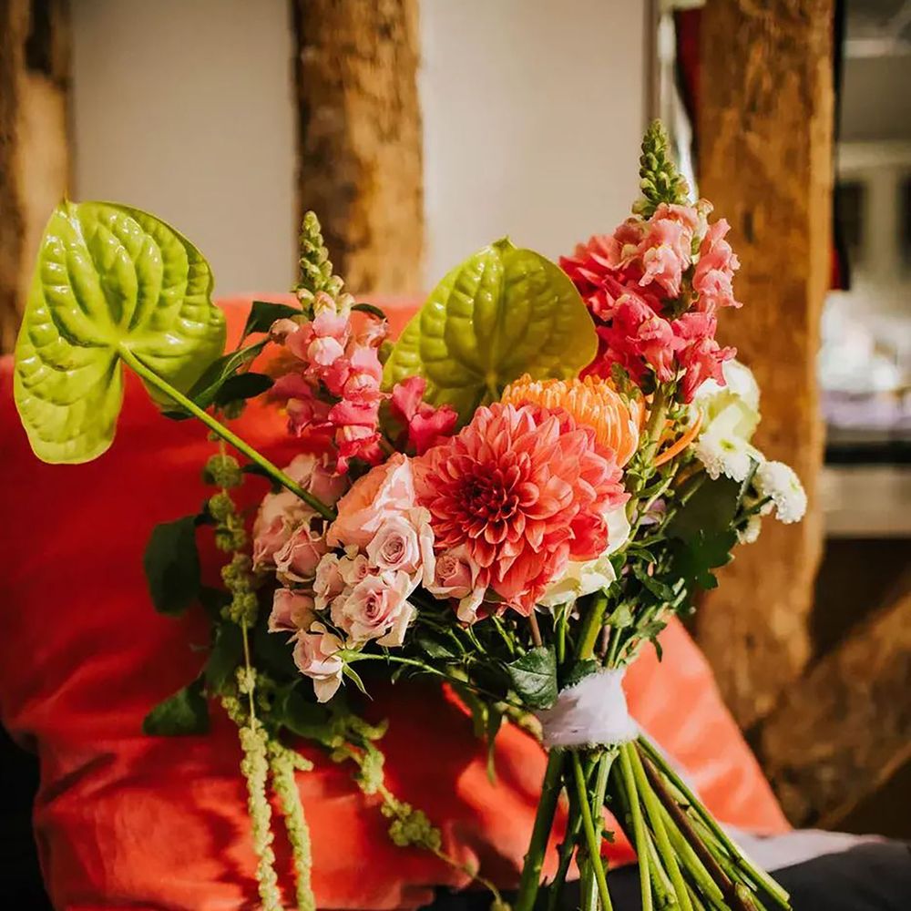 Green and pink wedding theme heels and bridal bouquet