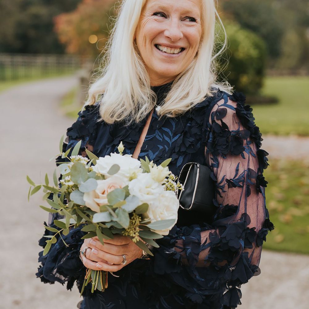 Navy blue wedding guest dress with sheer sleeves