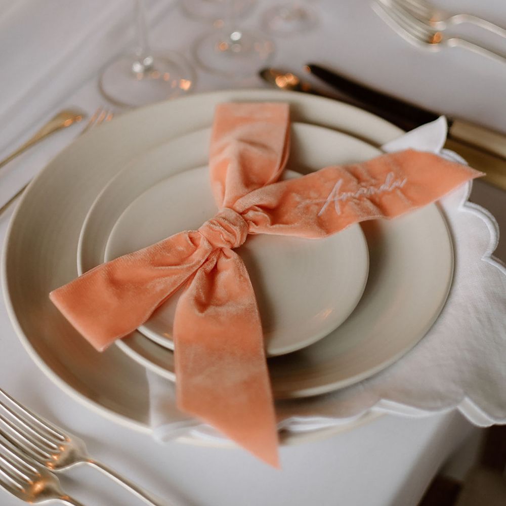 Velvet peach bow wedding place setting