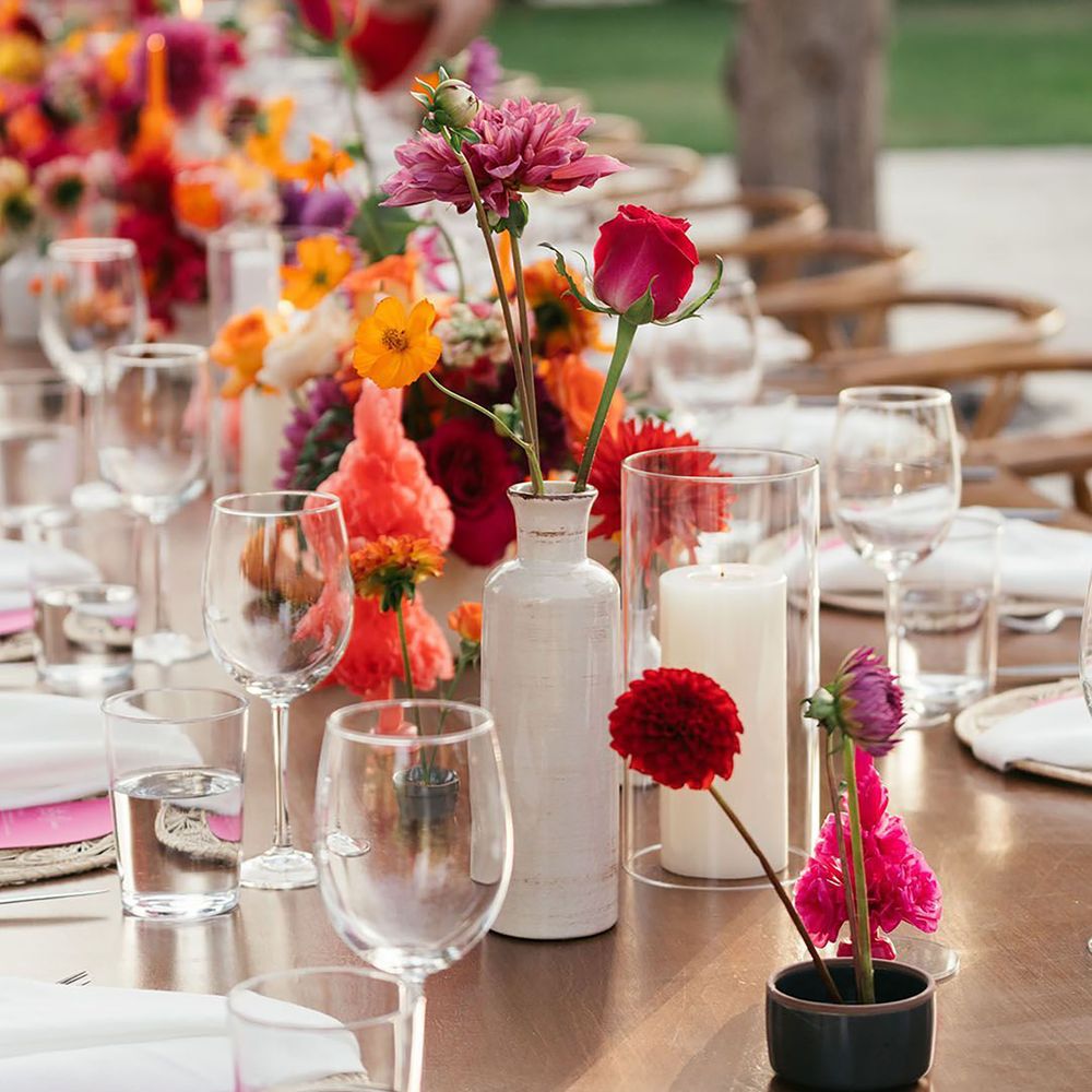 Pink colourful floral table arrangements
