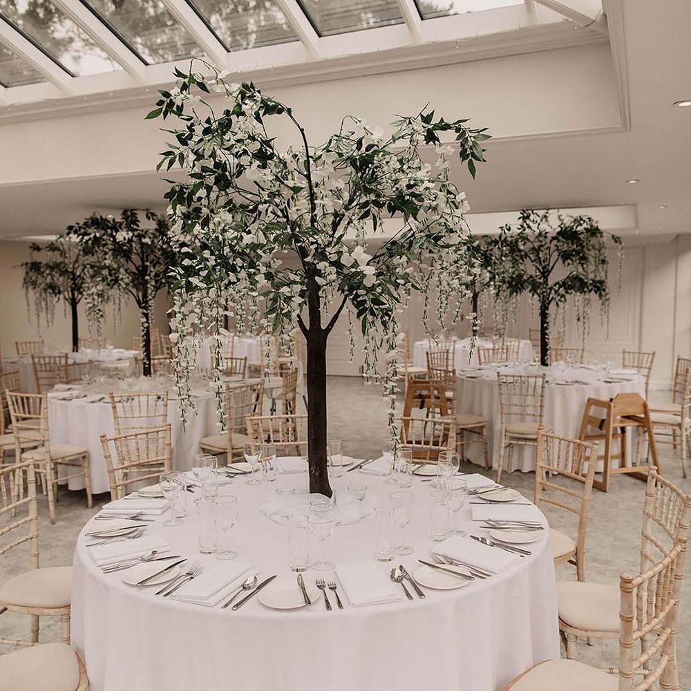 White wedding table with hanging tree