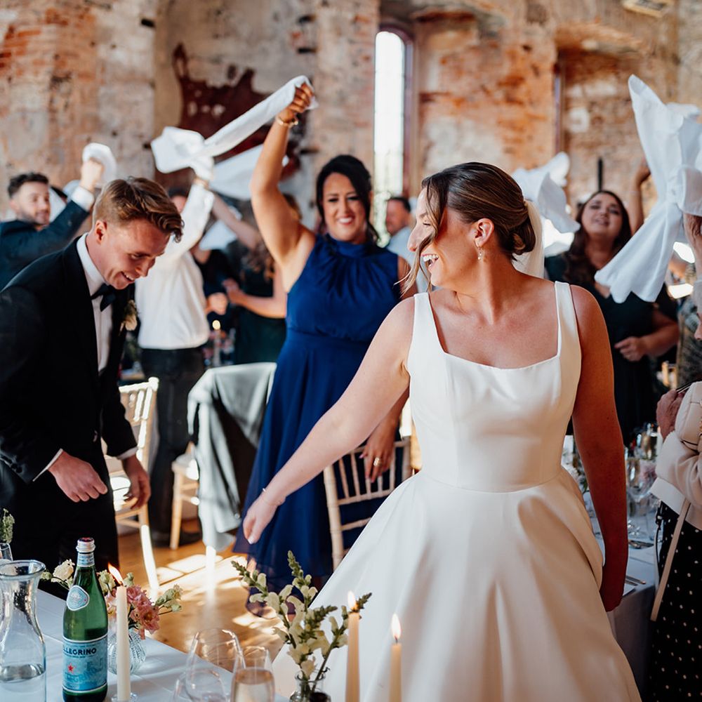 castle-weddings-with-guests-waving-napkins