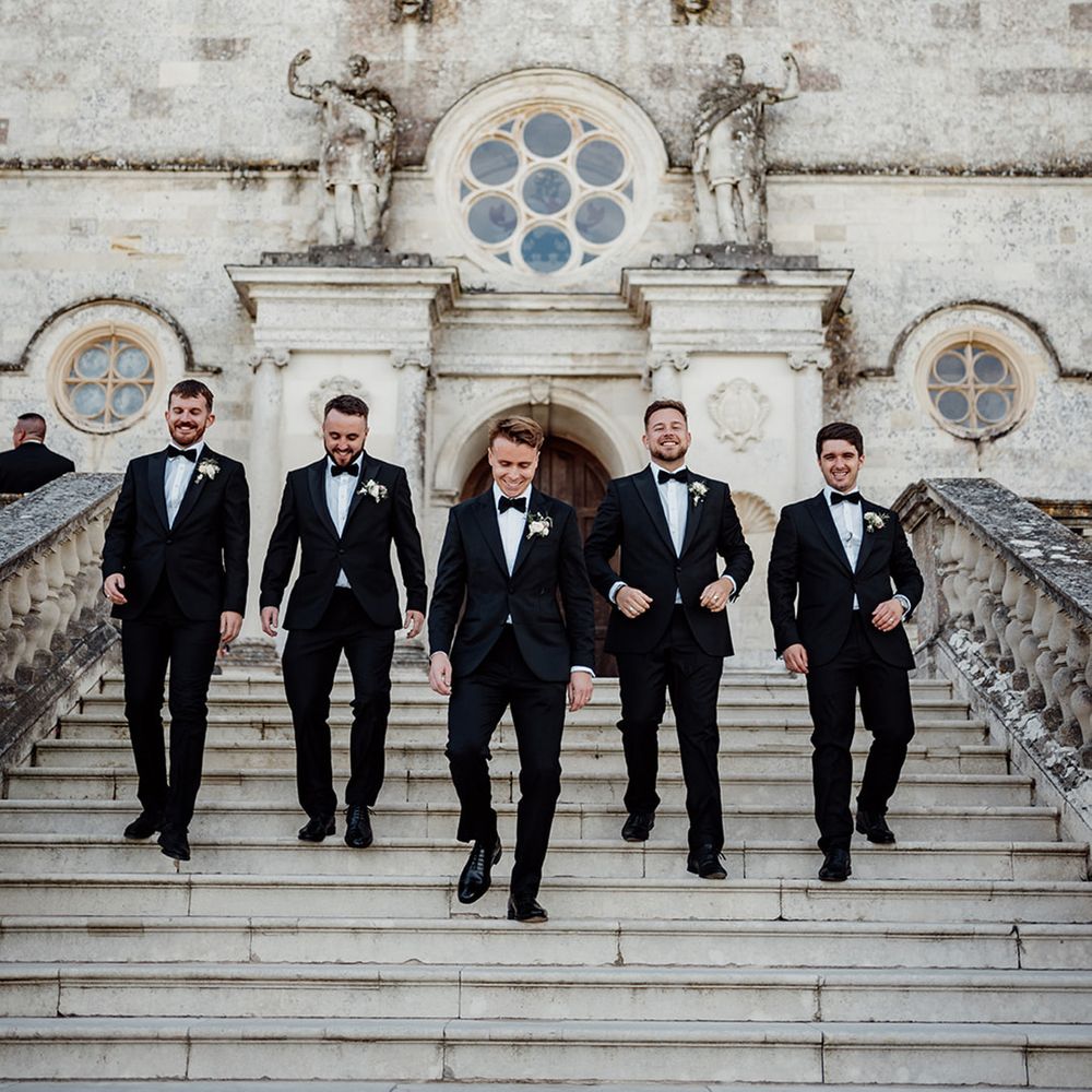 groomsmen-and-groom-in-black-tuxedos