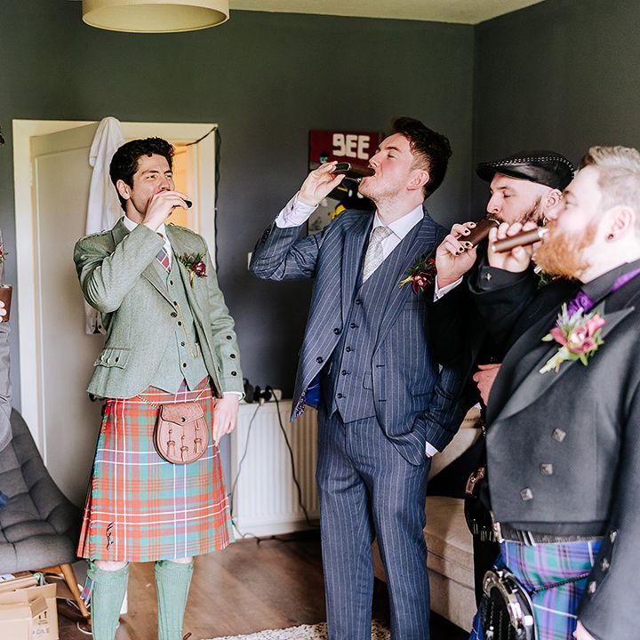 groom-and-groomsmen-drinking-together
