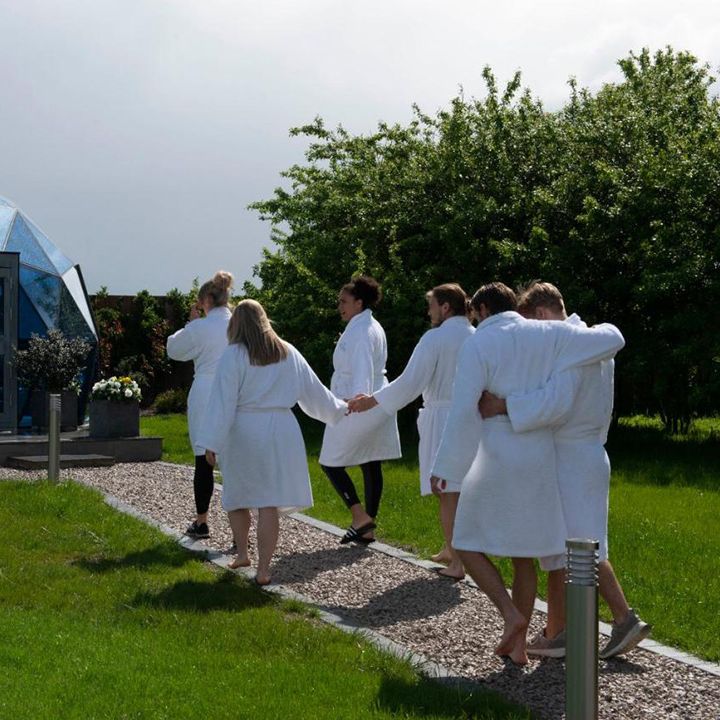 guests heading to glass house retreat's mindfulness dome