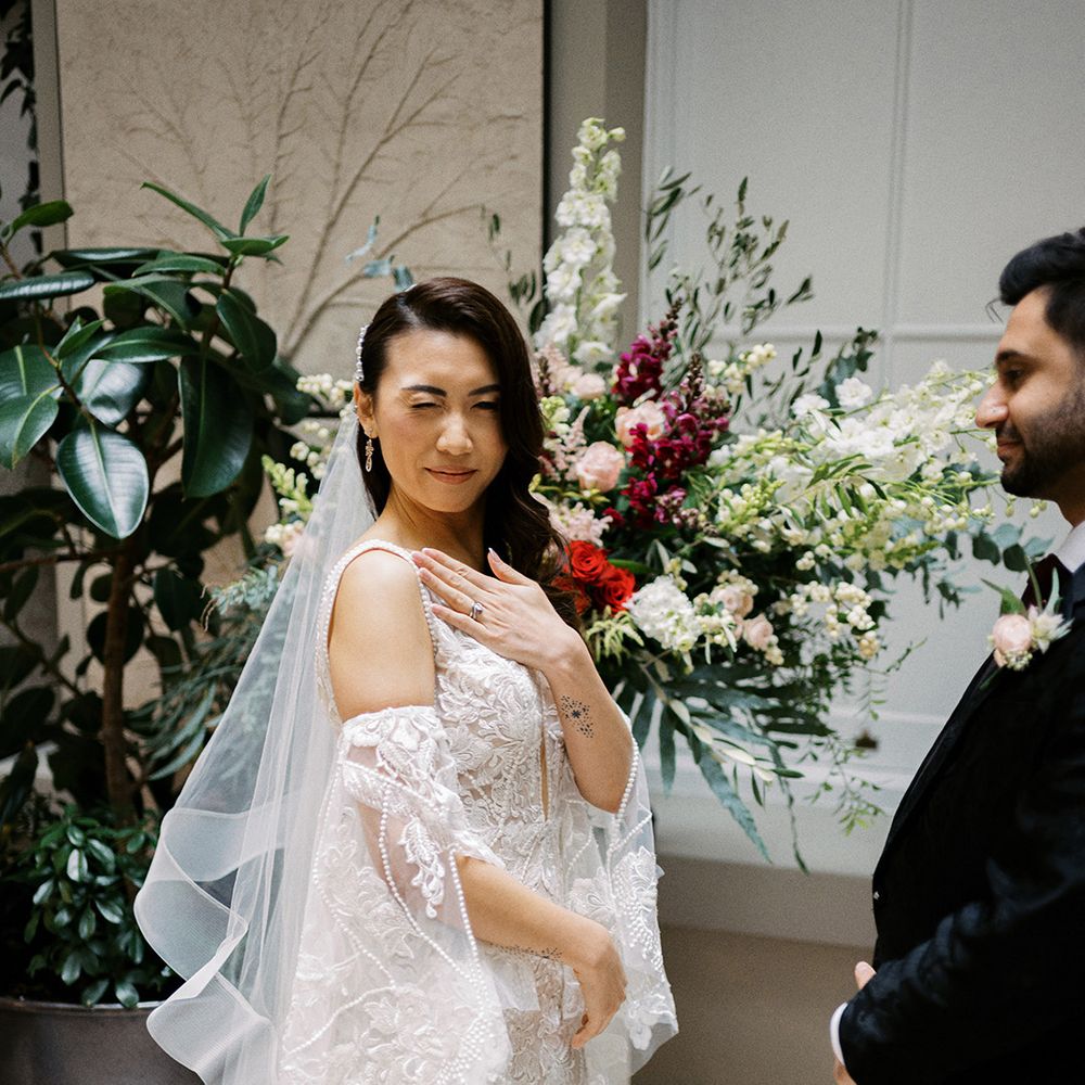 bride-wears-floral-lace-wedding-dress-with-veil