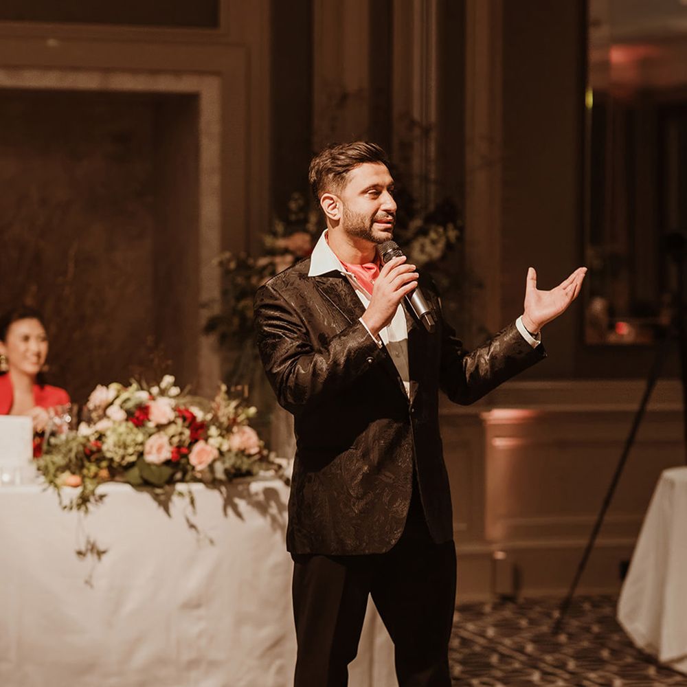 groom-reads-wedding-speech-in-floral-suit