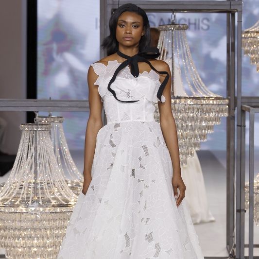 Isabel Sanchis Wedding Dress With Black Bow Neck Tie Barcelona Bridal Fashion Week 2025 Trend Report