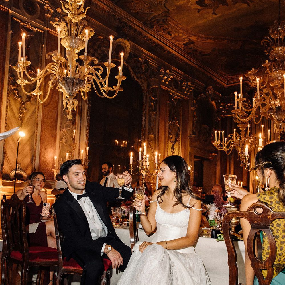 bride-and-groom-listen-to-wedding-speeches