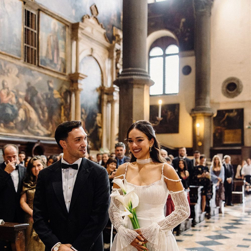 groom-smiles-at-bride-for-wedding-ceremony