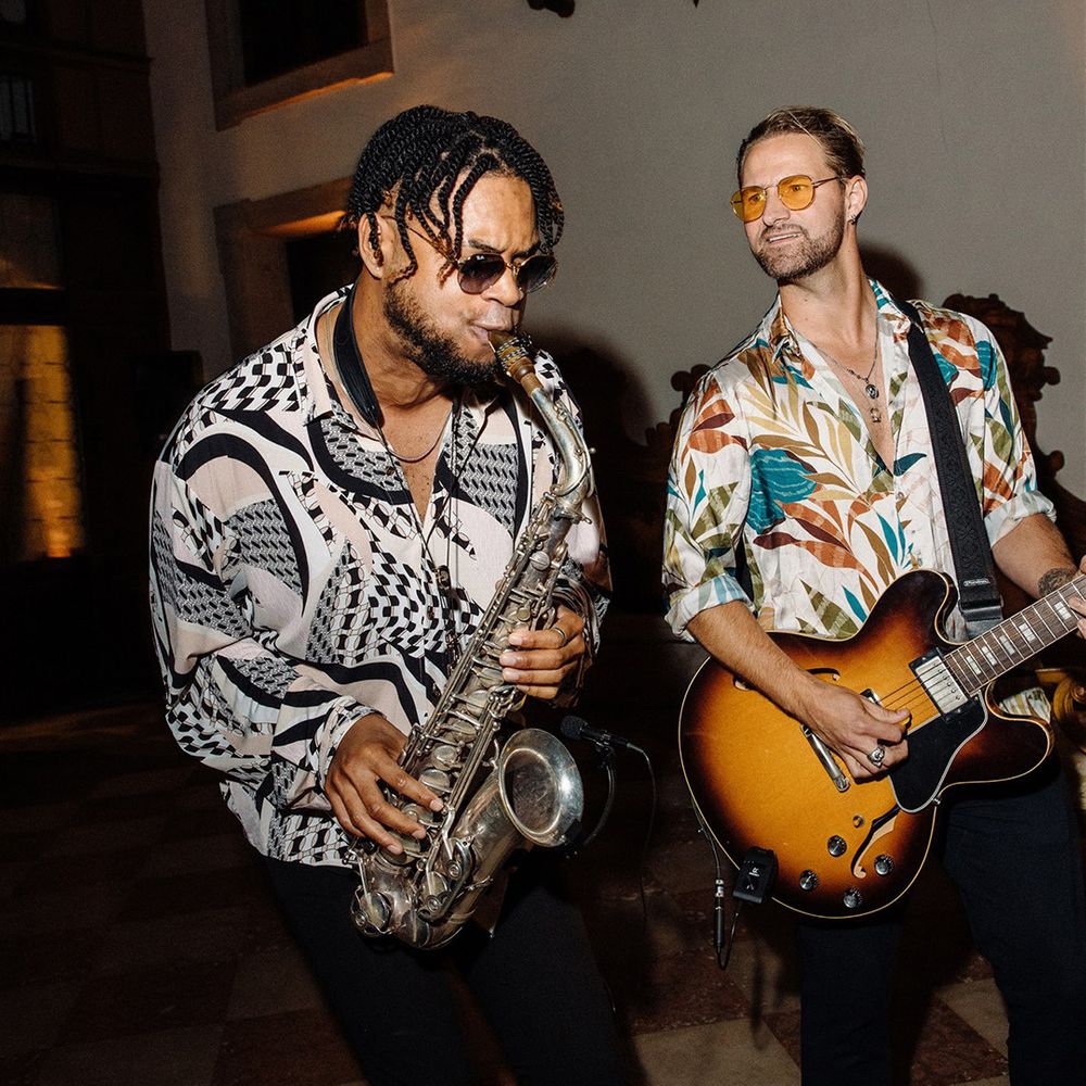 Wedding entertainment playing saxophone and guitar