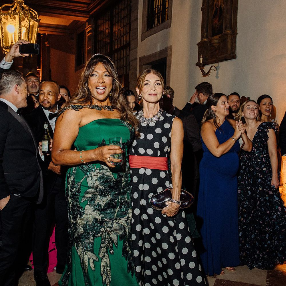 Wedding guests dancing together at wedding reception