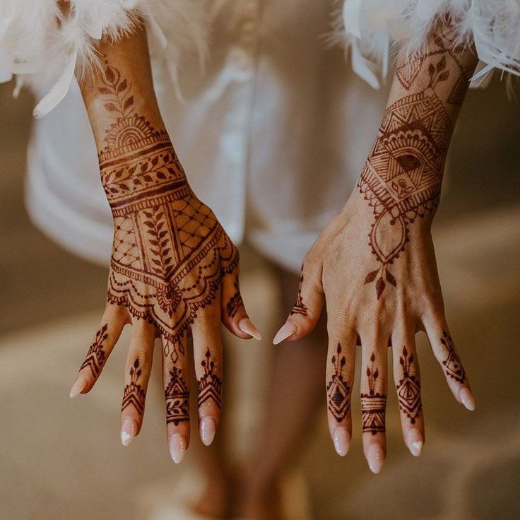 Bride Shows Off Henna and Neutral Almond Shaped Wedding Nails with White Heart