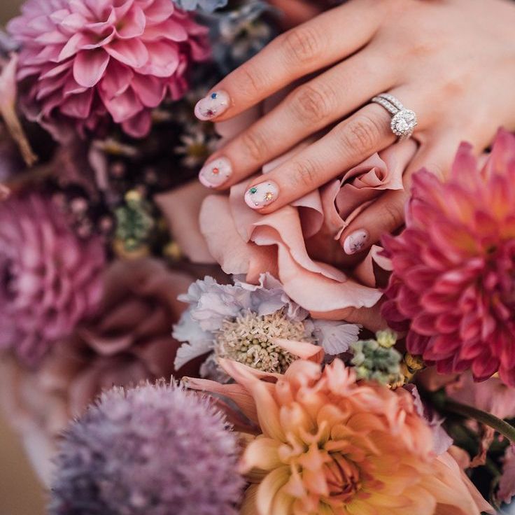 Bride Wearing Neutral Wedding Nails with Sparkly Colourful Star Nail Art