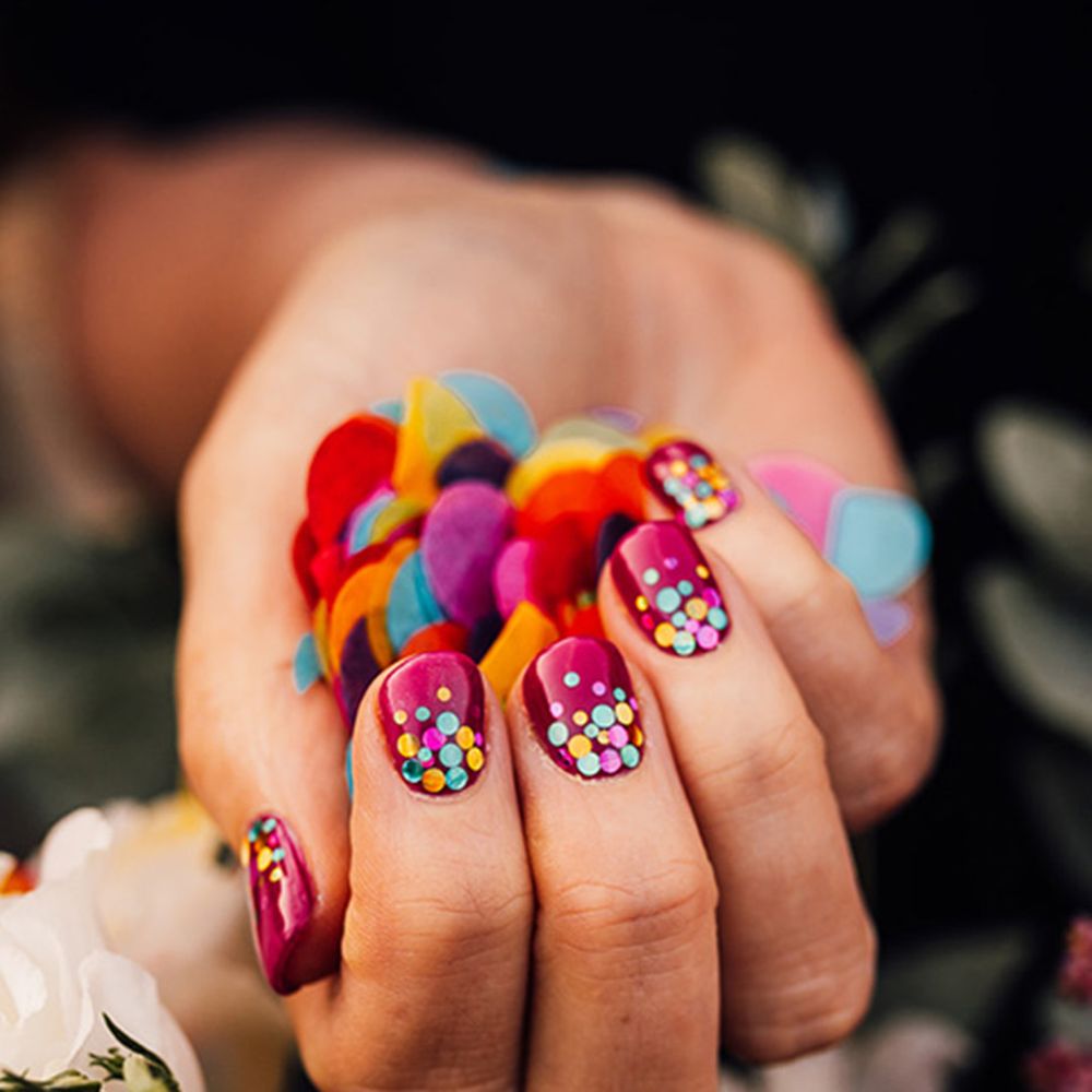 Bride wearing confetti nail art wedding nails