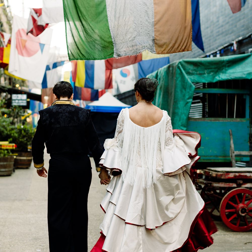 brides-walking-in-town-with-large-flags