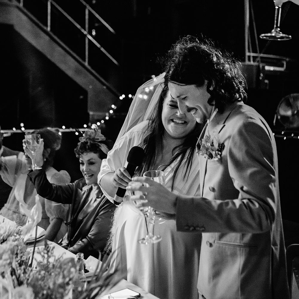 bride-and-groom-read-their-speeches-together.
