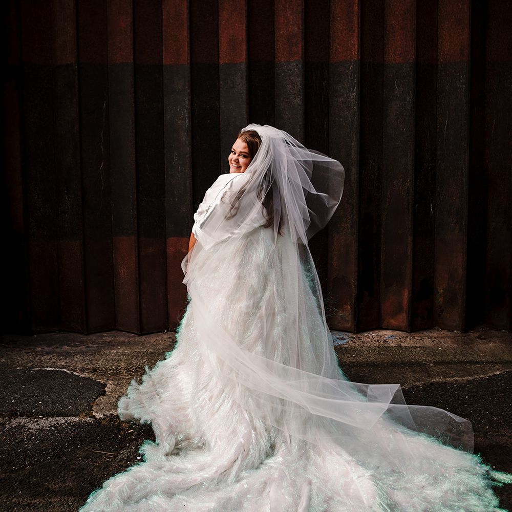 bride-wears-holographic-tassel-wedding-dress-and-veil