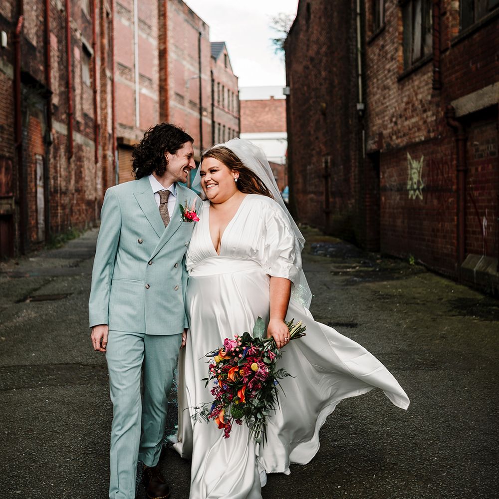 couple-portrait-of-bride-and-groom-at-wedding-in-modern-wedding-outfits