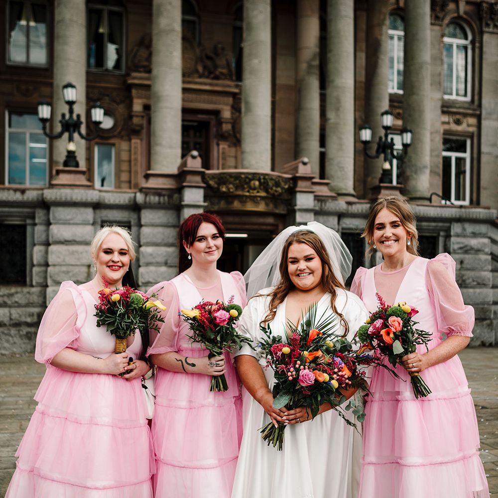 short-midi-pink-bridesmaid-dresses-with-bride-in-short-sleeve-wedding-dress