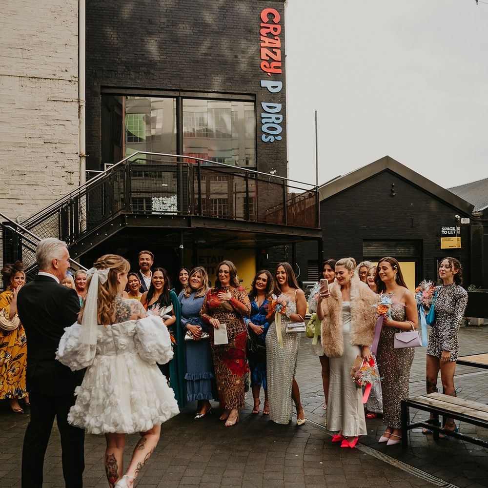 bride-arrives-to-greet-wedding-party
