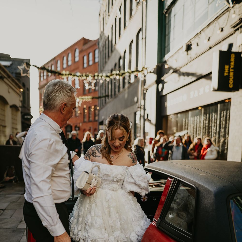 bride-in-short-wedding-dress-gets-out-of-wedding-car