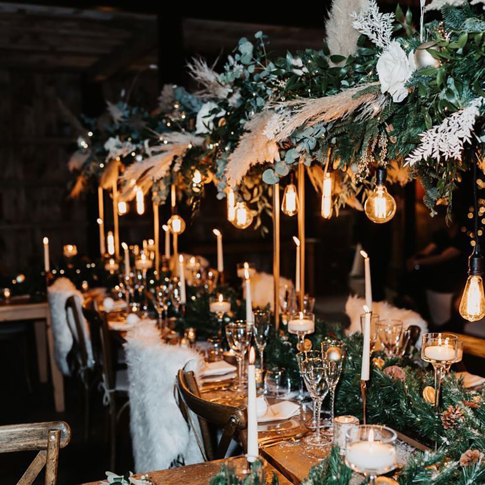 Winter Wonderland Cosy Table Setting with Candles & Exposed Lightbulbs and White Flower Arrangement