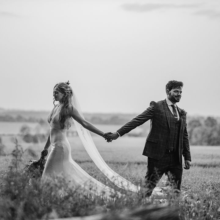 bride-and-groom-holding-hands-for-couple-photo