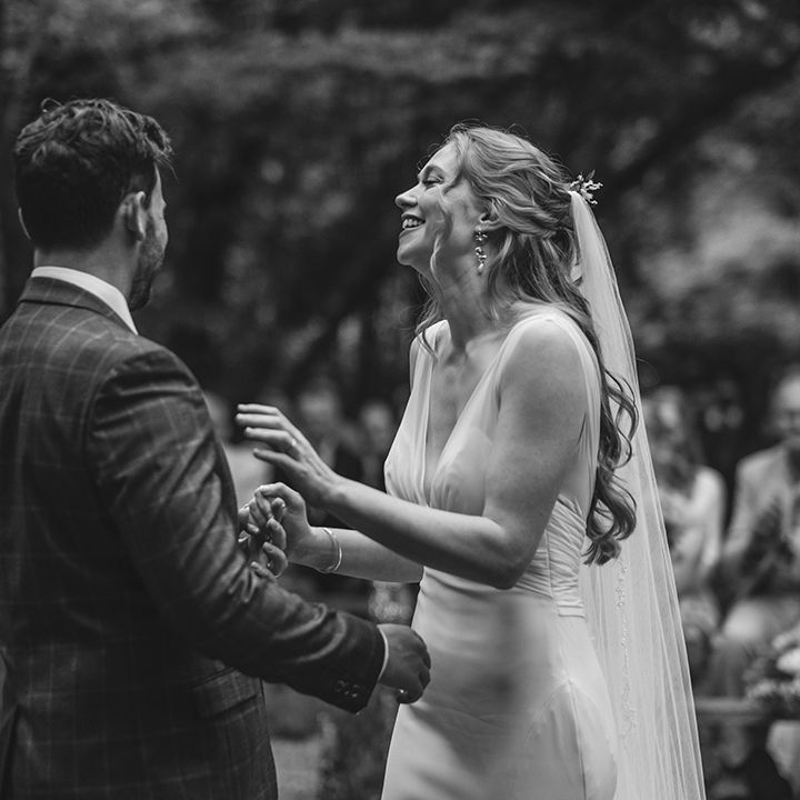 couple-laughs-during-their-wedding-ceremony