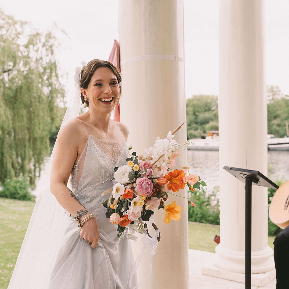 bride-carrying-pastel-coloured-bouquet